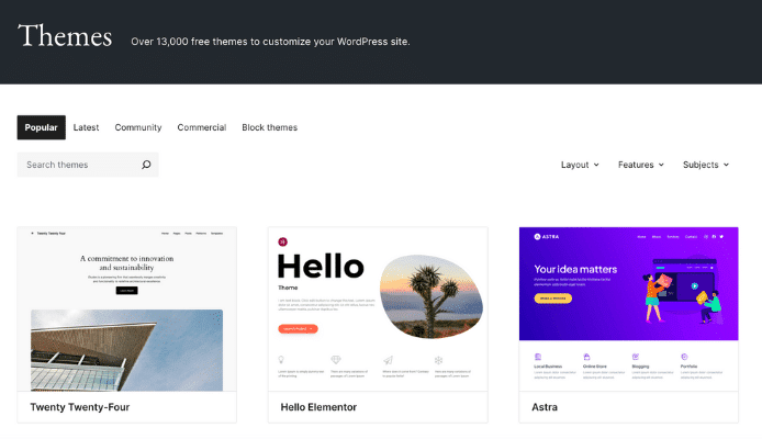 Screenshot of the WordPress theme selection page showing a black header with the text, "Themes - Over 13,000 free themes to customize your WordPress site." Below are navigation tabs for "Popular," "Latest," "Community," "Commercial," and "Block themes," along with a search bar. Three theme examples are displayed: "Twenty Twenty-Four" with an architectural image, "Hello Elementor" with a circular image of desert plants, and "Astra" with a purple background featuring illustrated characters and design elements.